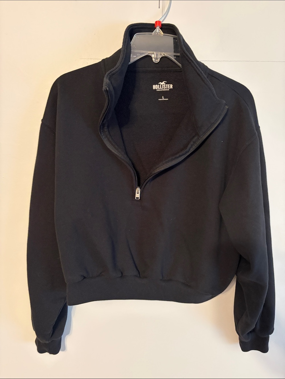 Hollister woman’s Black Half-Zip Sweatshirt. Large. Cotton/poly.